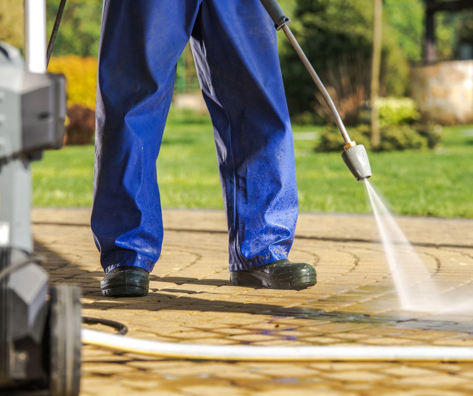 Pressure cleaning professional with high pressure washing equipment